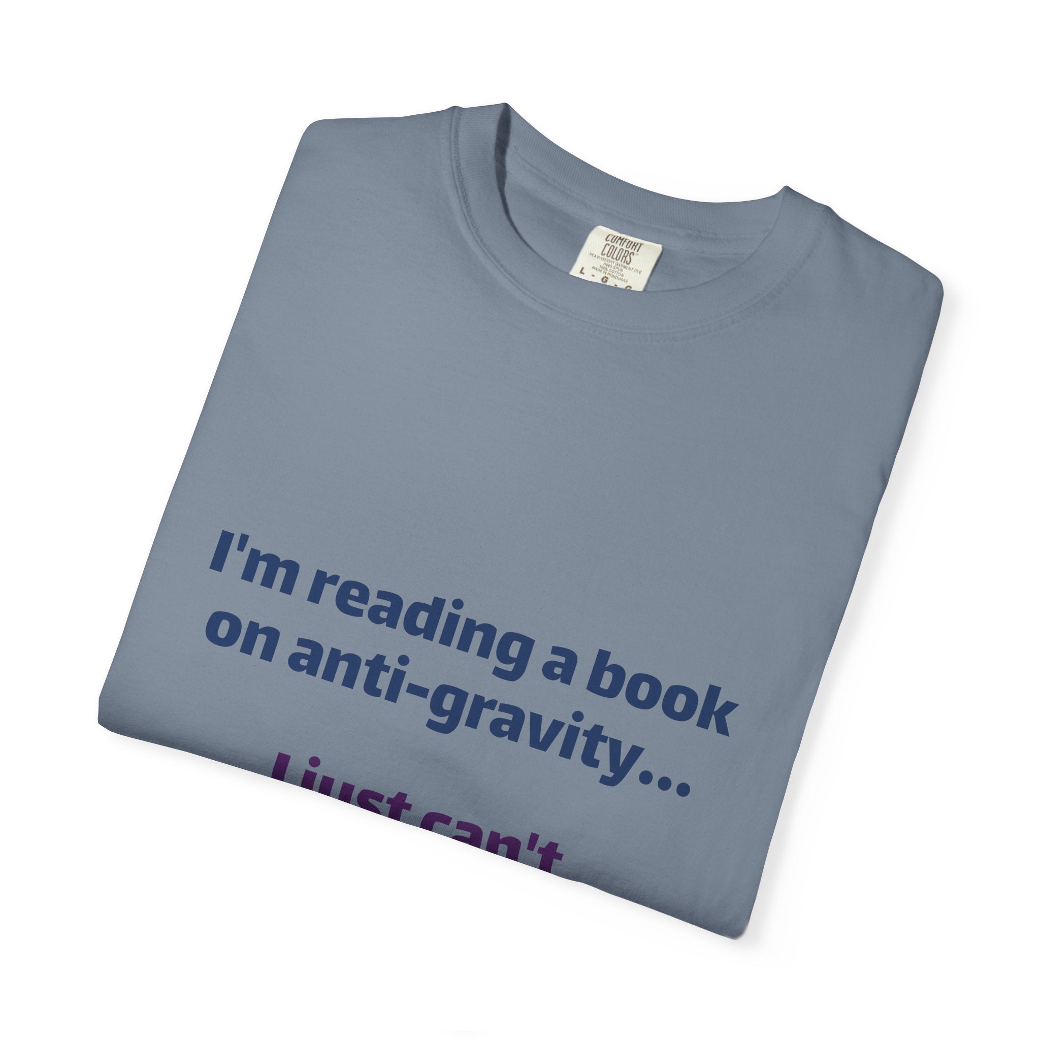 Humor Book Lovers T-Shirt — “I’m reading a book on anti-gravity… I just can’t put it down.”