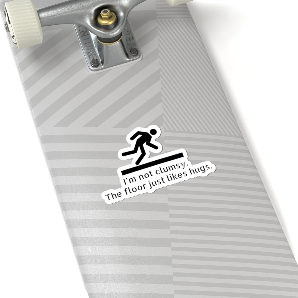Funny Clumsy Sticker — “I’m not clumsy. The floor just likes hugs.” Kiss-Cut Laptop Decal