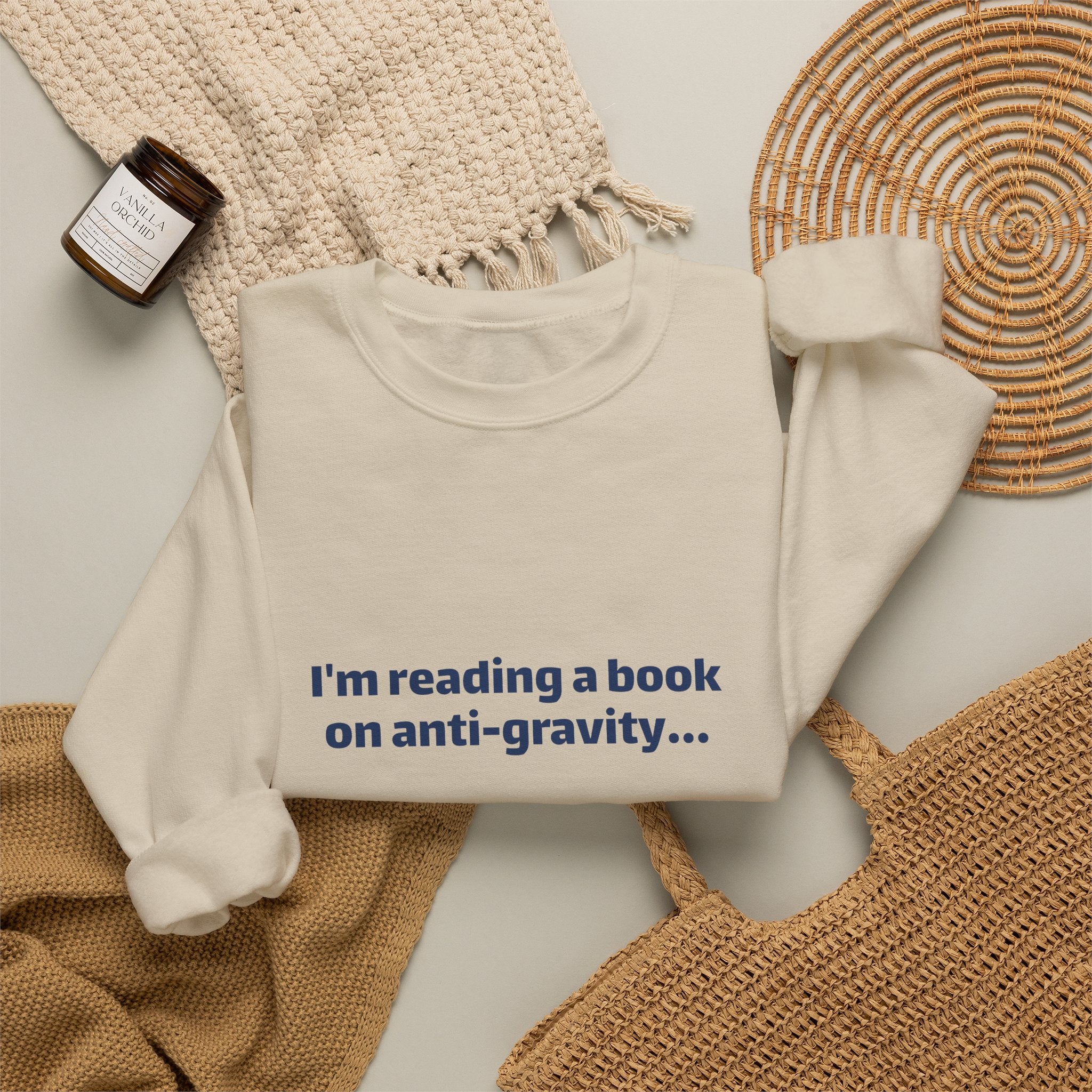 Crewneck Sweatshirt – Funny Book Nerd Quote: "I'm reading a book on anti-gravity... I just can't put it down."