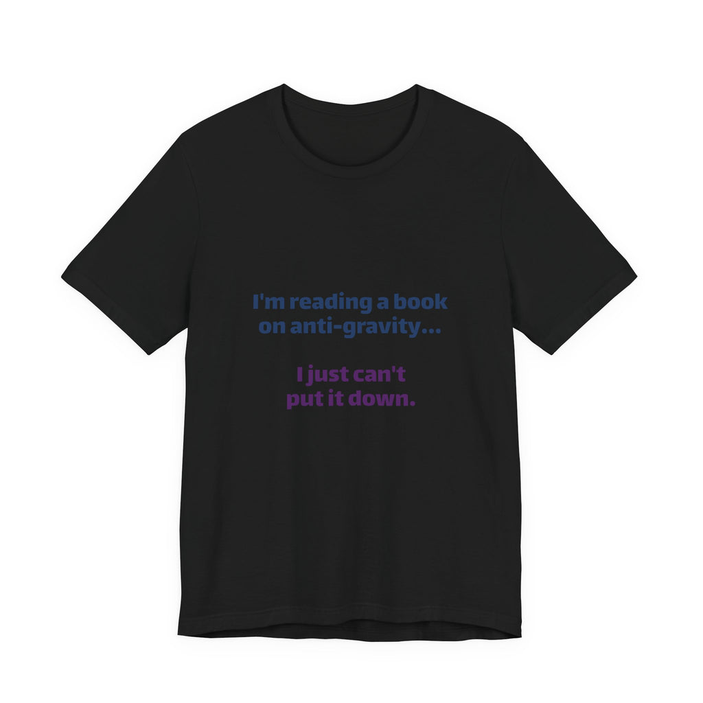 Funny Book Lover T‑Shirt — “I’m reading a book on anti-gravity… I just can’t put it down.”