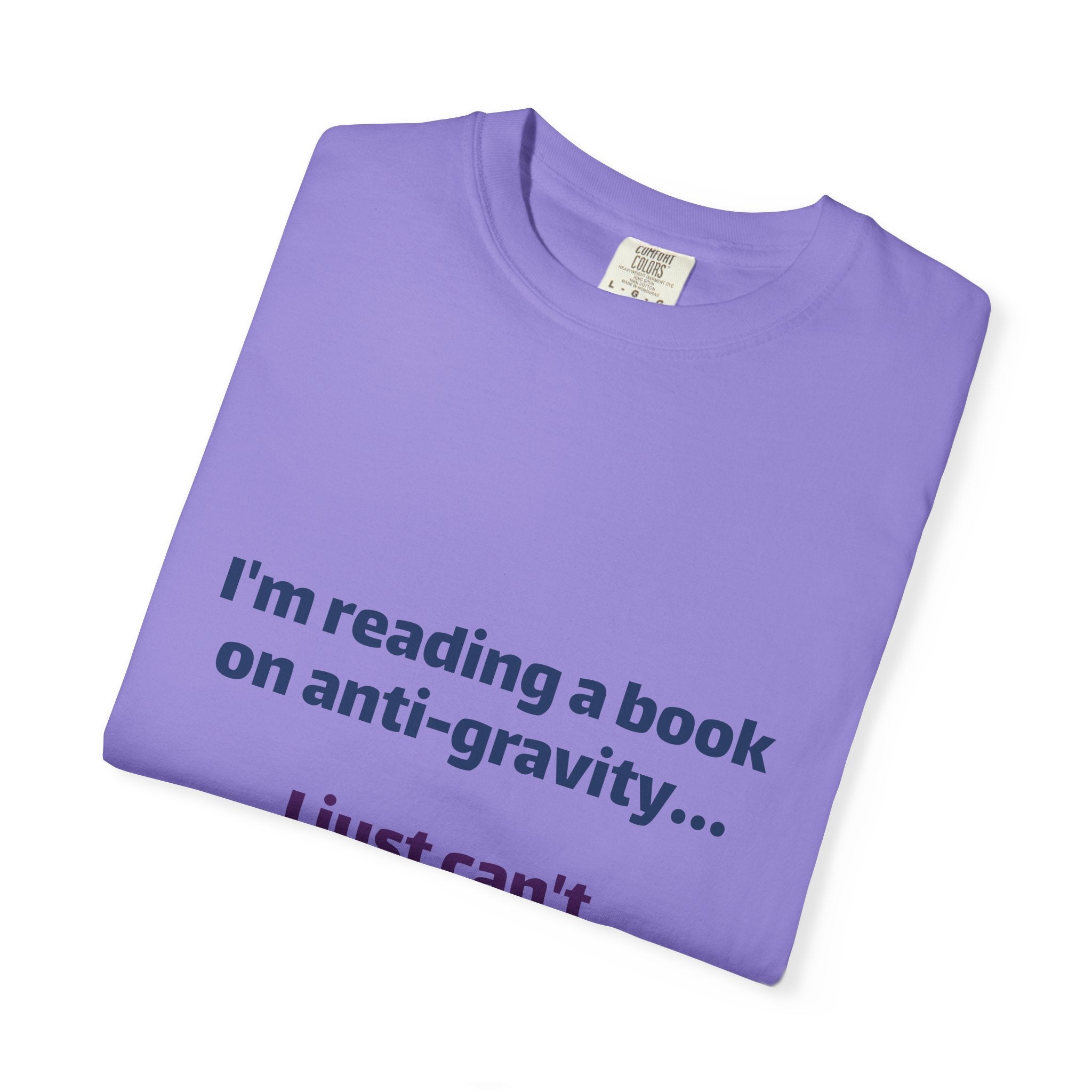Humor Book Lovers T-Shirt — “I’m reading a book on anti-gravity… I just can’t put it down.”