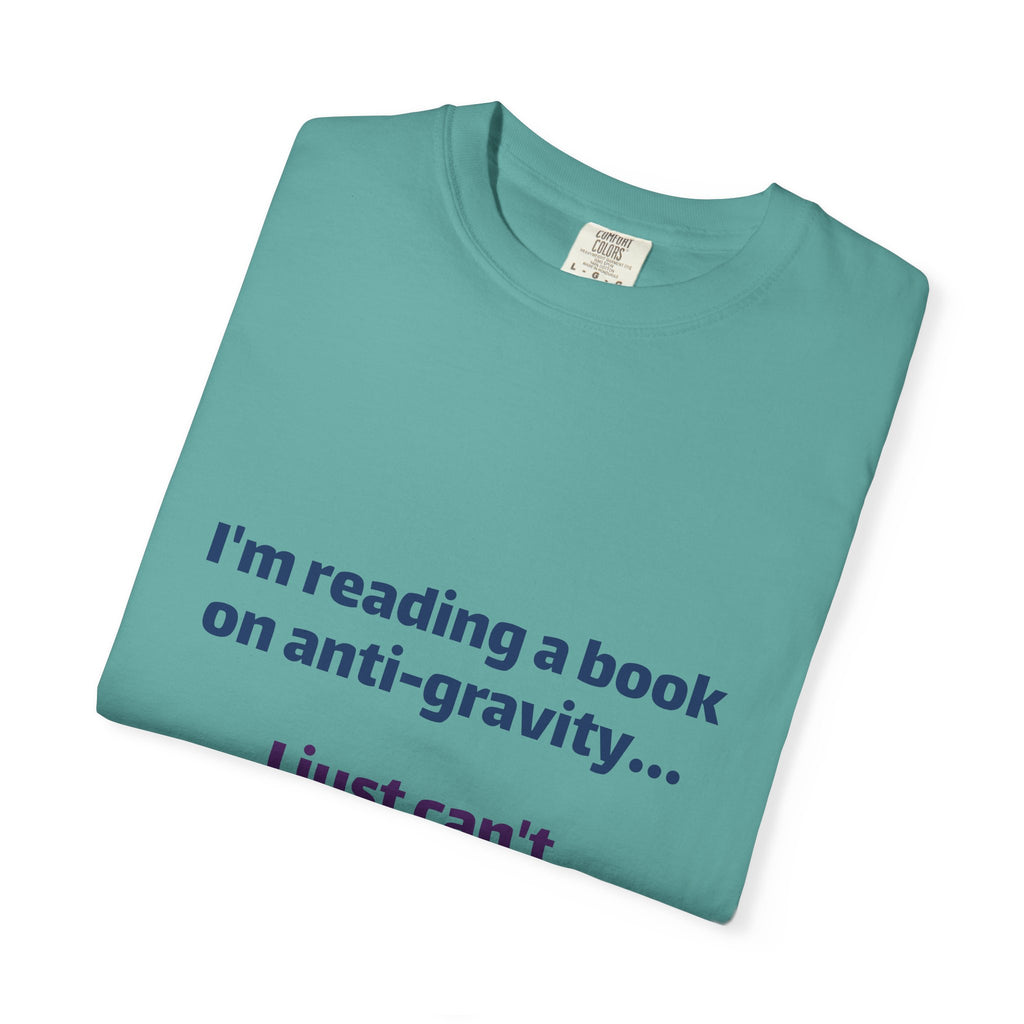 Humor Book Lovers T-Shirt — “I’m reading a book on anti-gravity… I just can’t put it down.”