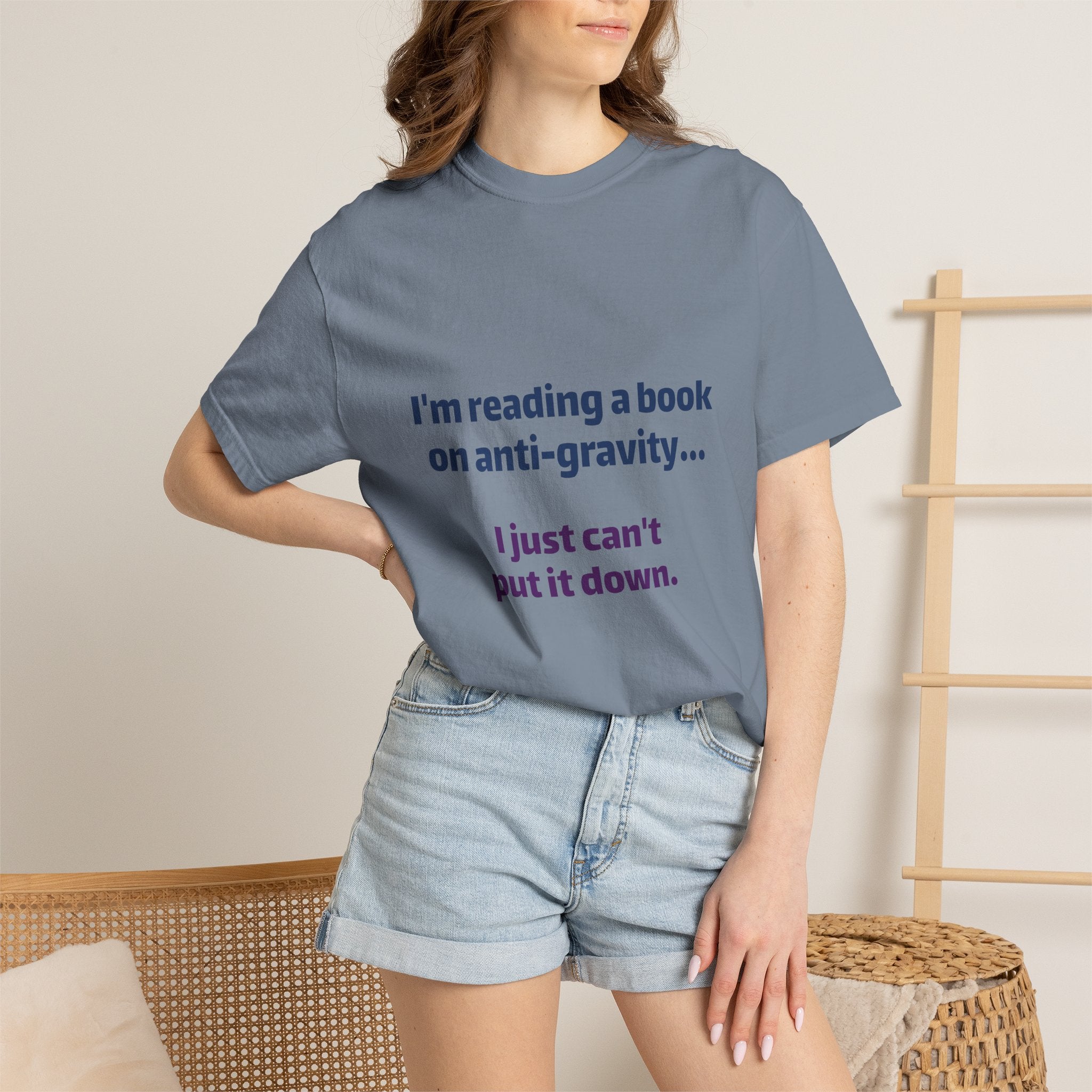 Humor Book Lovers T-Shirt — “I’m reading a book on anti-gravity… I just can’t put it down.”