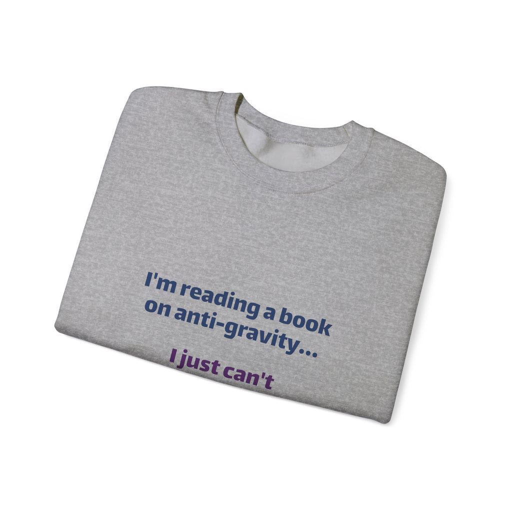 Crewneck Sweatshirt – Funny Book Nerd Quote: "I'm reading a book on anti-gravity... I just can't put it down."