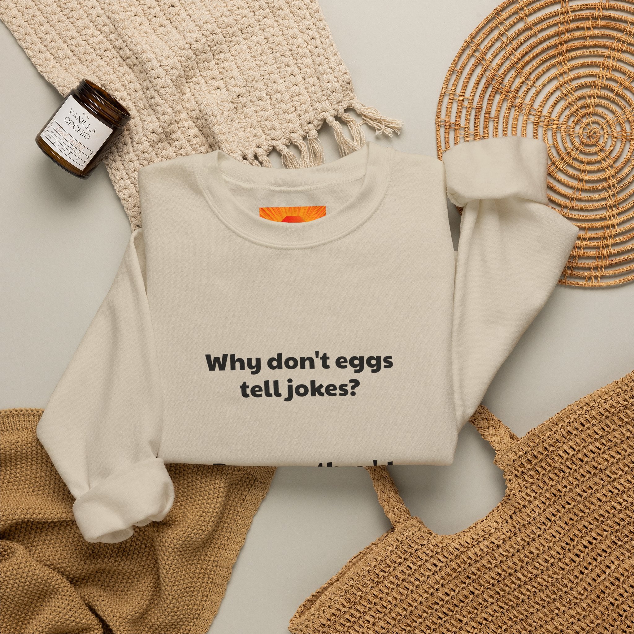 Crewneck Sweatshirt — "Why don't eggs tell jokes? Because they'd crack each other up." Funny Pun Graphic