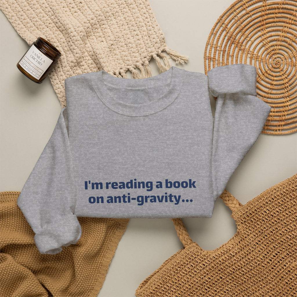 Crewneck Sweatshirt – Funny Book Nerd Quote: "I'm reading a book on anti-gravity... I just can't put it down."