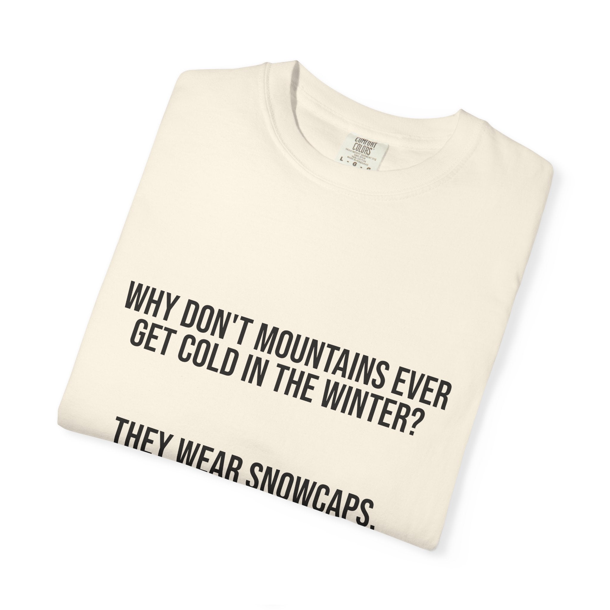 T-Shirt — "Why Don't Mountains Ever Get Cold in the Winter? They Wear Snowcaps." Funny Winter Mountain Tee