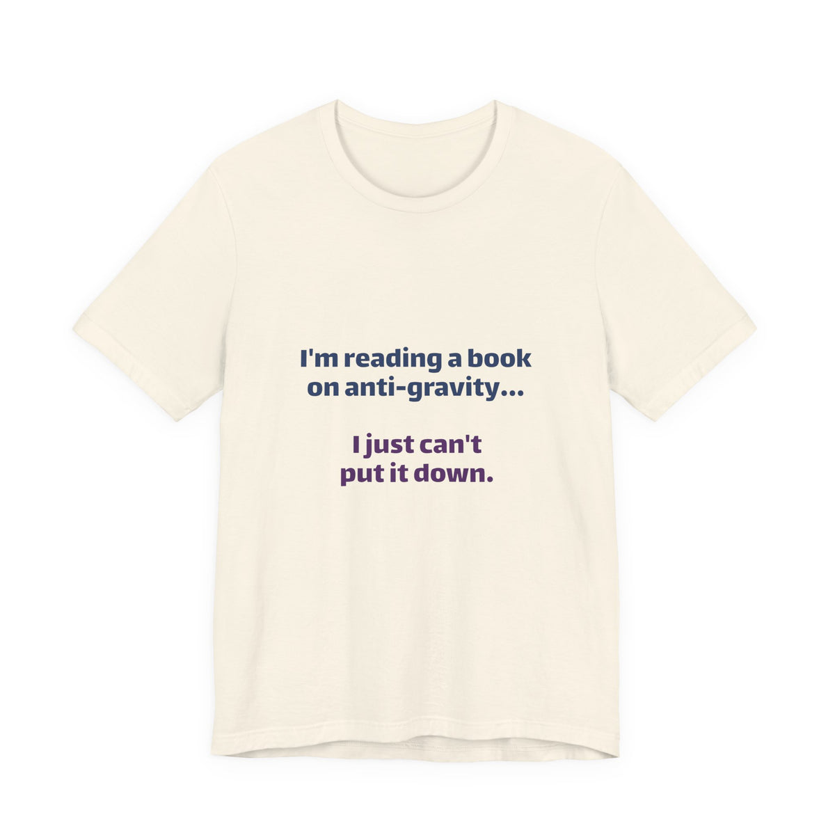 Funny Book Lover T‑Shirt — “I’m reading a book on anti-gravity… I just can’t put it down.”