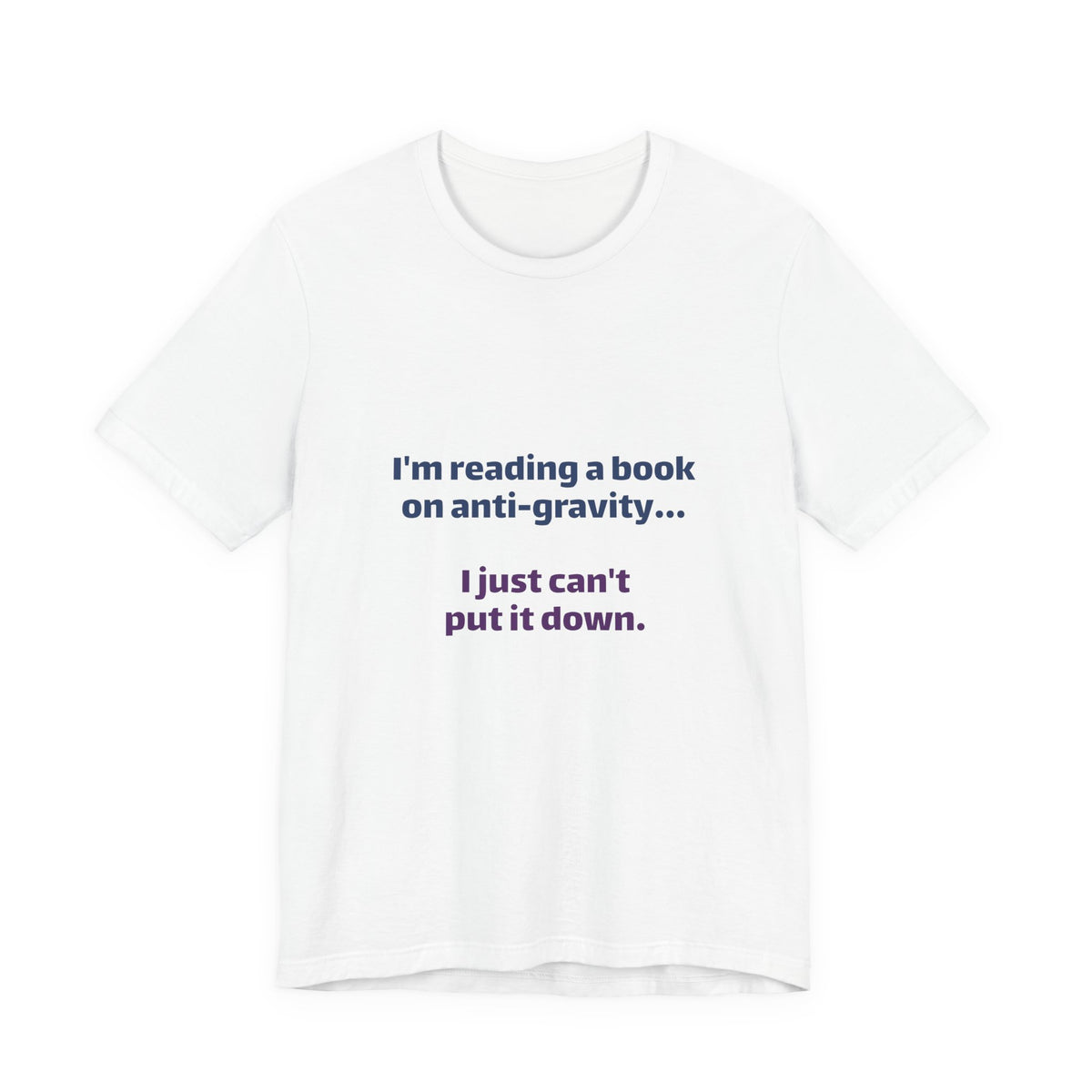 Funny Book Lover T‑Shirt — “I’m reading a book on anti-gravity… I just can’t put it down.”