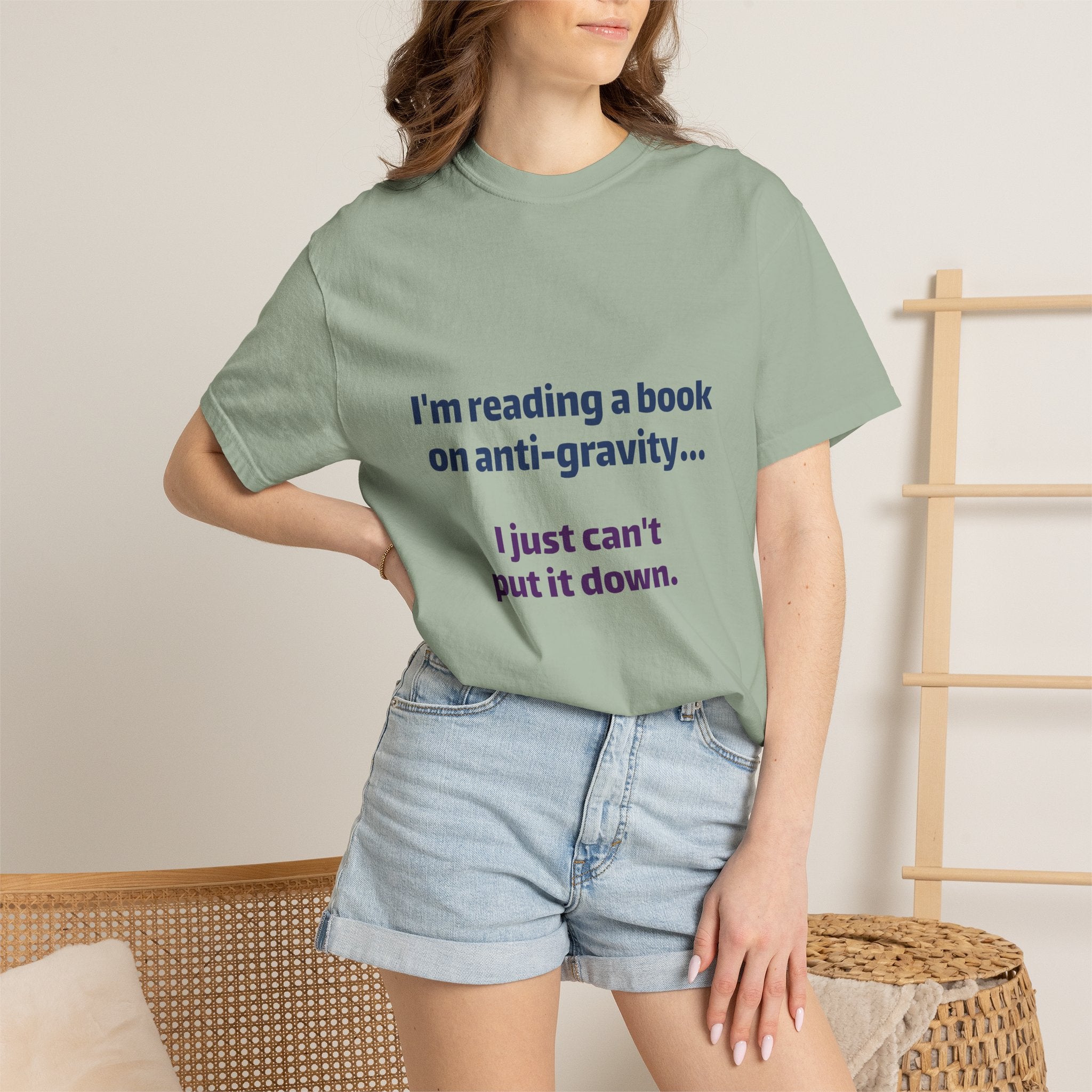 Humor Book Lovers T-Shirt — “I’m reading a book on anti-gravity… I just can’t put it down.”