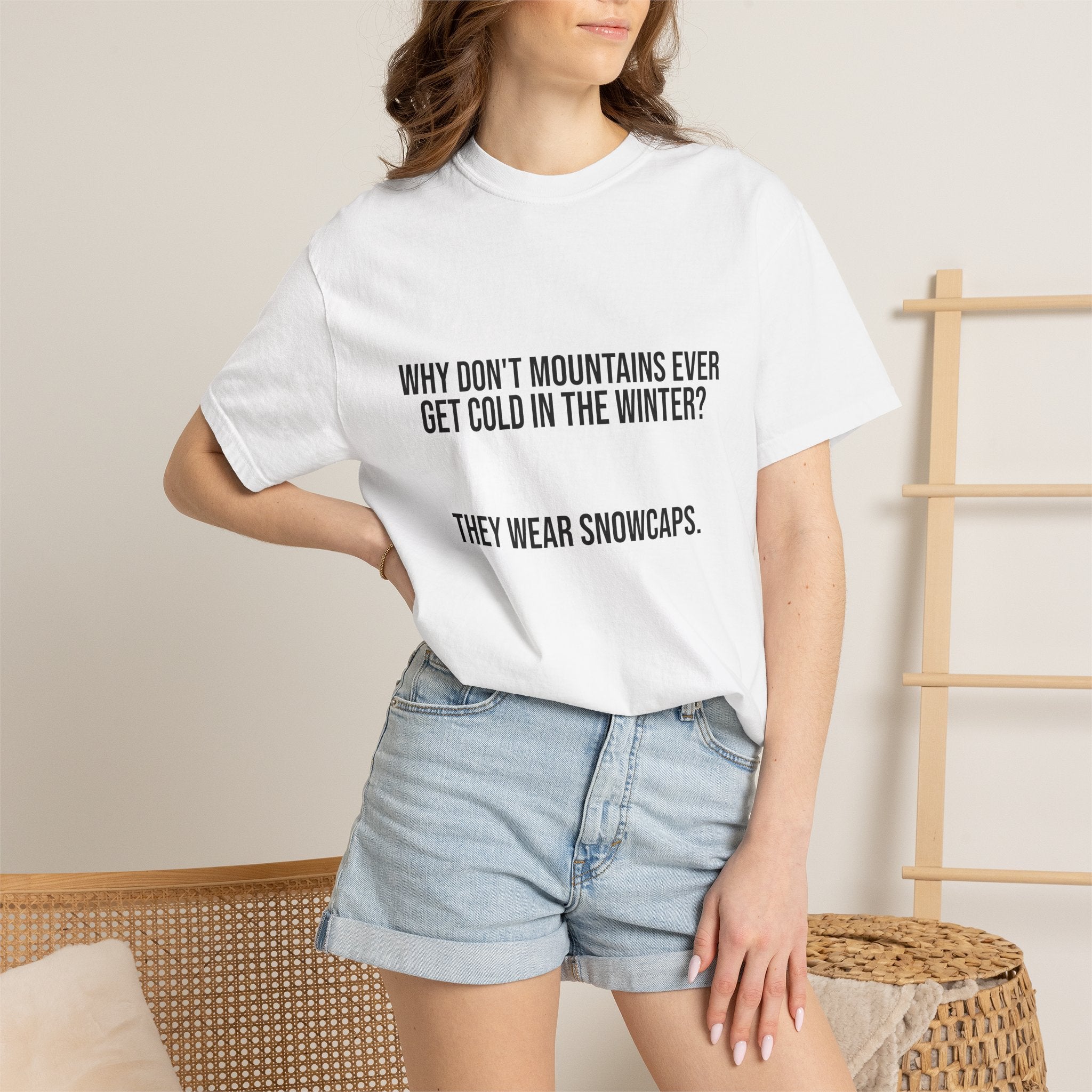 T-Shirt — "Why Don't Mountains Ever Get Cold in the Winter? They Wear Snowcaps." Funny Winter Mountain Tee