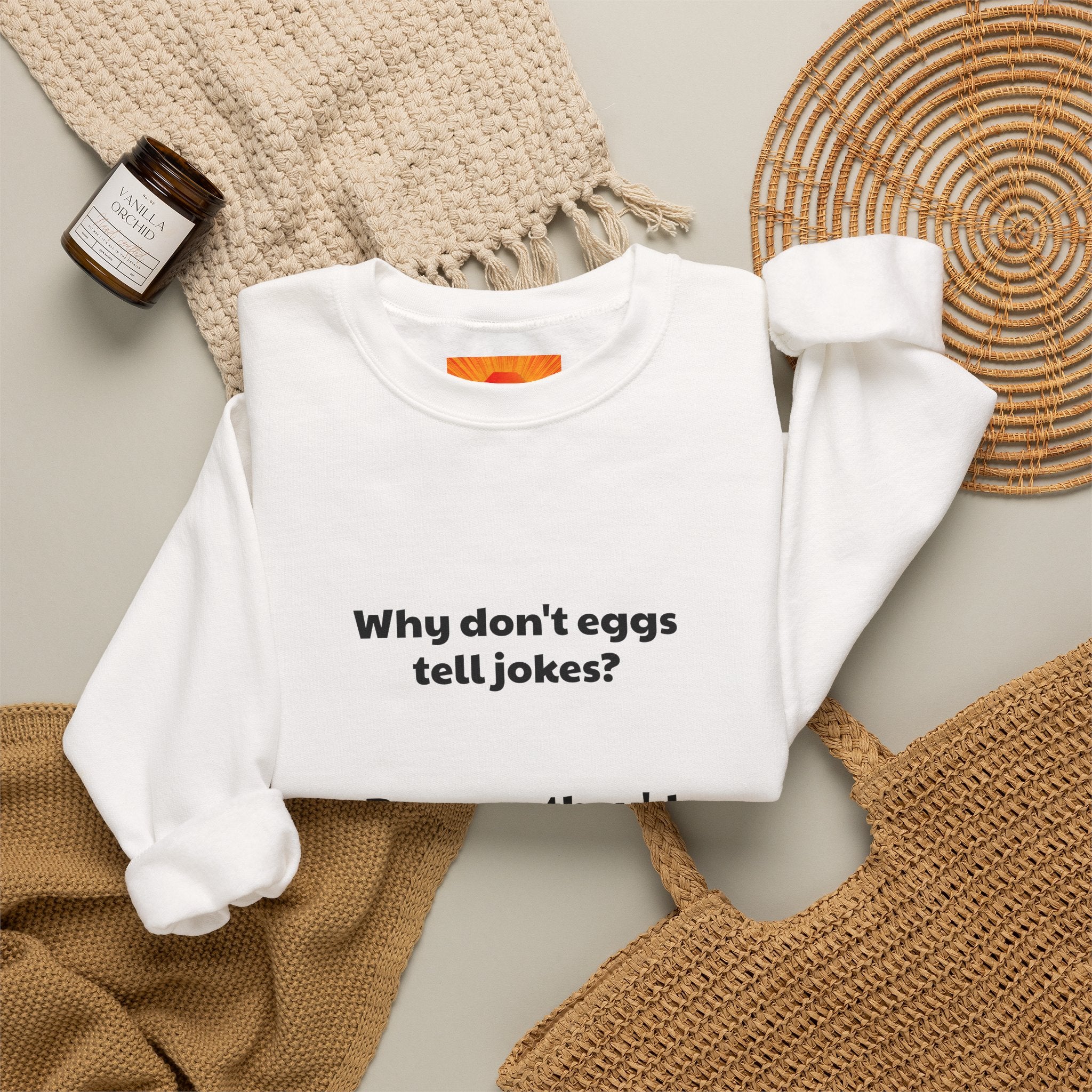 Crewneck Sweatshirt — "Why don't eggs tell jokes? Because they'd crack each other up." Funny Pun Graphic