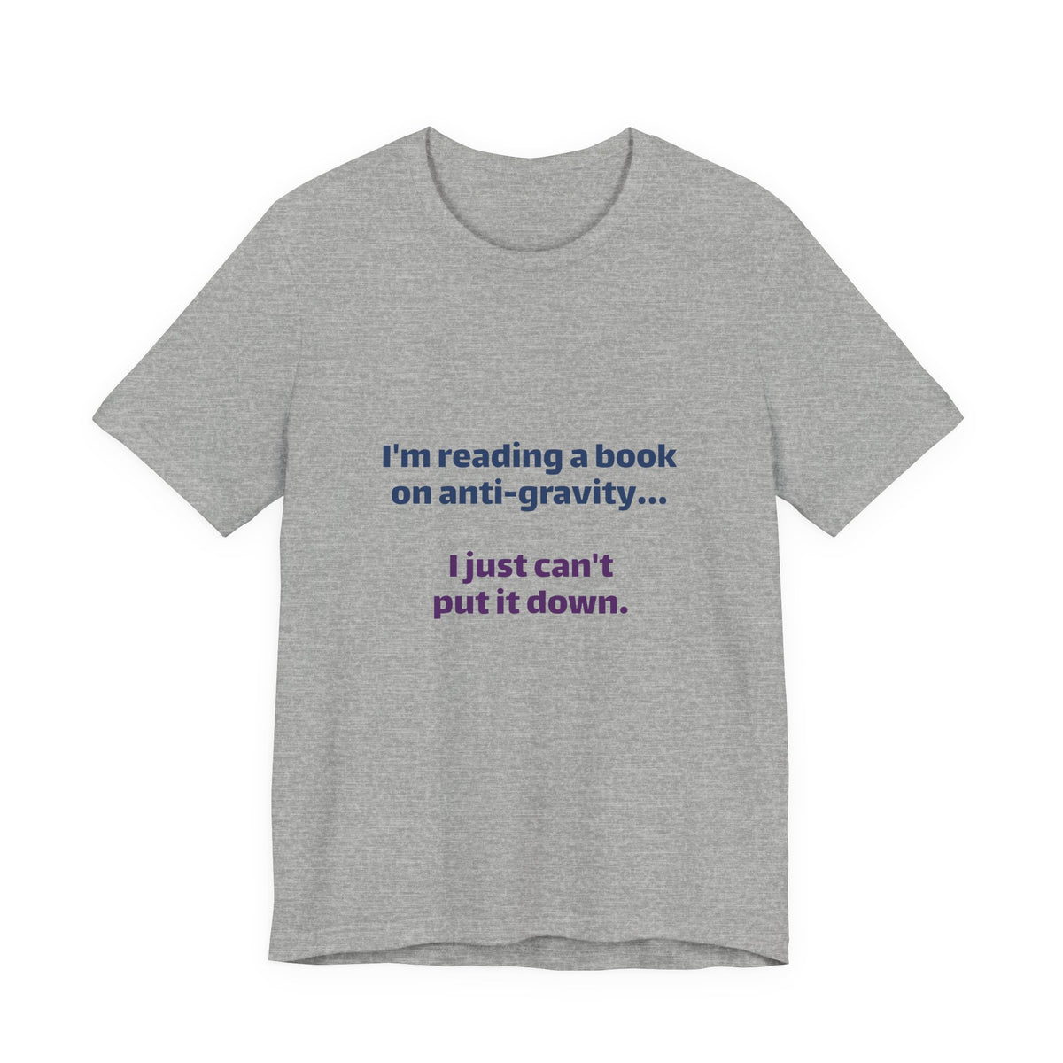 Funny Book Lover T‑Shirt — “I’m reading a book on anti-gravity… I just can’t put it down.”
